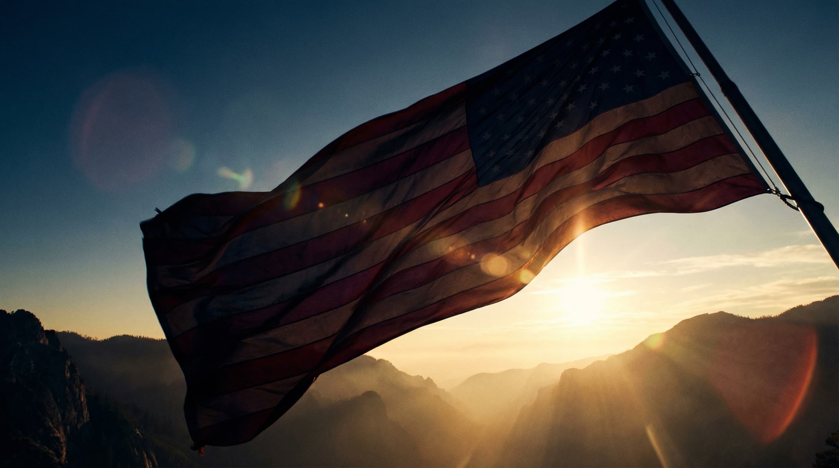 American flag against a twilight sky